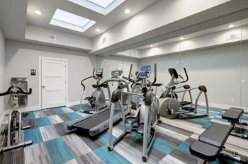 a gym with a lot of exercise equipment
